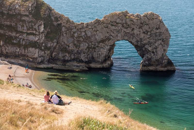 The iconic arch of Durdle Door on the Dorset Coast.  Visit here and the sheltered and beautiful Lulworth Cove.
