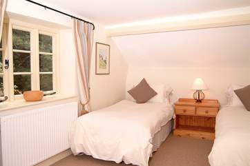 The 'zip and link' bedroom (Bedroom 4) here seen made up as twins.