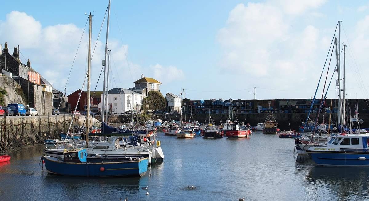 Mevagissey is a working fishing port with narrow streets, ancient pubs and cosy tea-rooms.