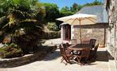 The sunny dining-area in the sheltered courtyard. - Thumbnail Image