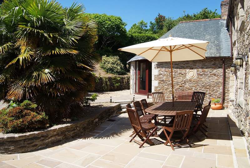 The sunny dining-area in the sheltered courtyard.