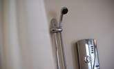 An adjustable shower head in the wet-room. - Thumbnail Image