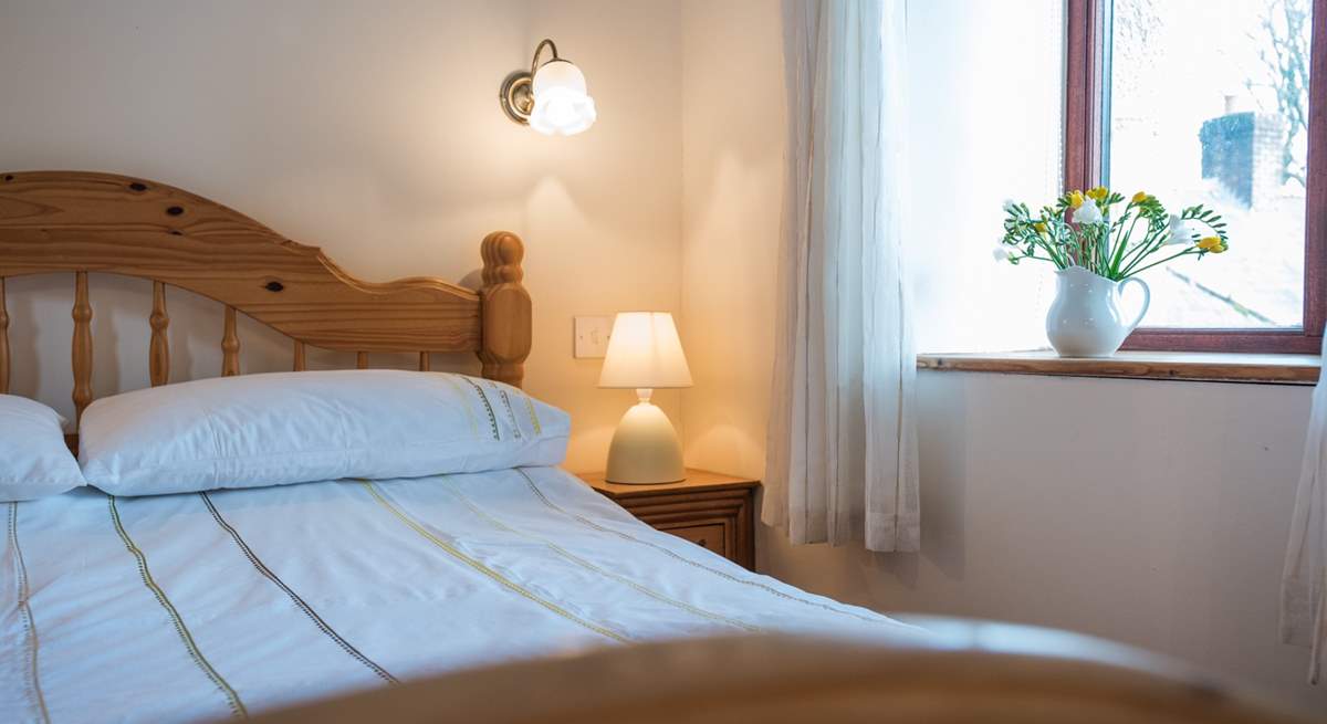 Bedroom 3 looks over the courtyard and countryside to the rear.