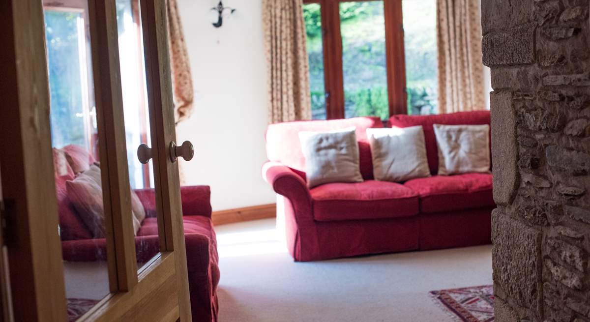 Looking into the sitting-room from the bottom of the stairs.