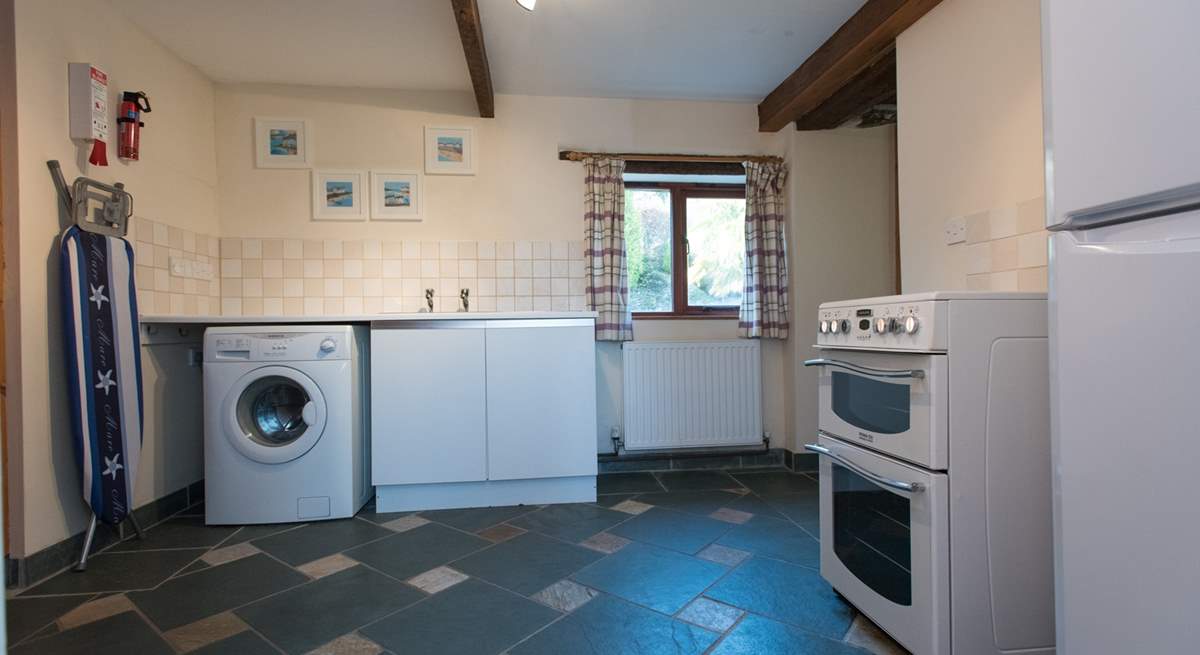 The utility-room has an electric cooker, washing machine and fridge/freezer, plus a shower-room and separate WC.