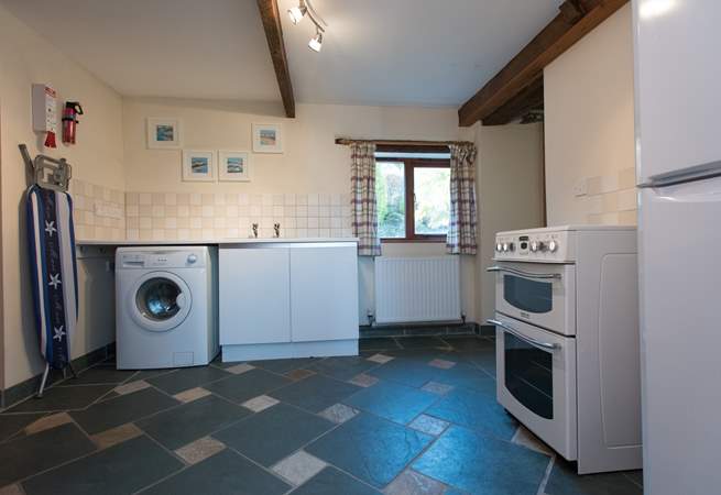 The utility-room has an electric cooker, washing machine and fridge/freezer, plus a shower-room and separate WC.