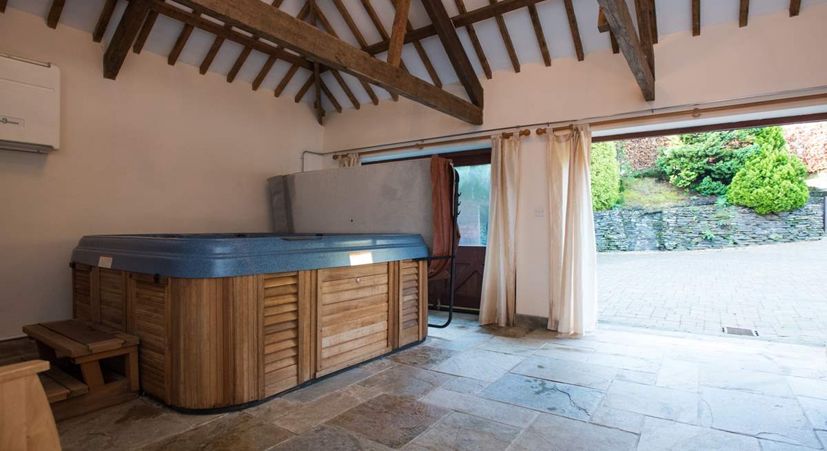 The garden-room houses the wonderful hot tub, and doors open out to a sheltered courtyard.