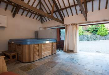 The garden-room houses the wonderful hot tub, and doors open out to a sheltered courtyard.