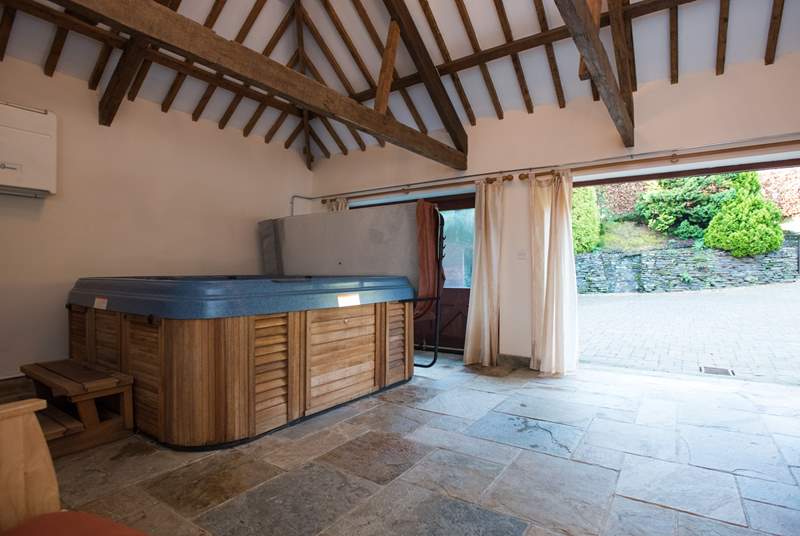 The garden-room houses the wonderful hot tub, and doors open out to a sheltered courtyard.