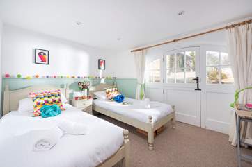 Doors lead out to the decked terrace from the twin bedroom.
