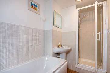 The bathroom also has a separate shower cubicle.