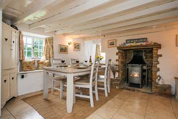 The dining-area with its cosy wood-burner effect electric stove makes this an ideal retreat whatever the weather.