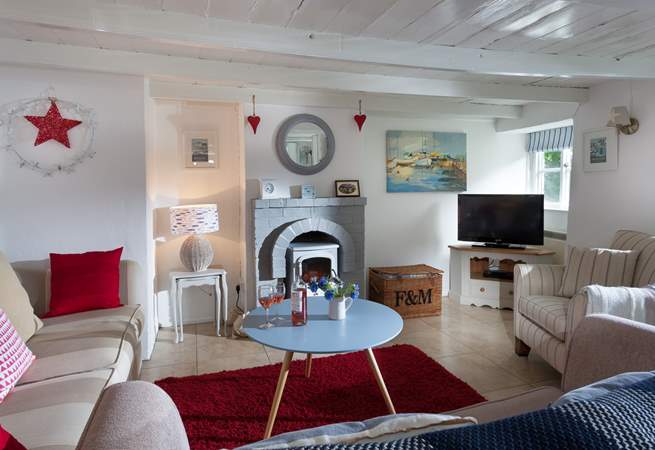 The lovely sitting room. As you would expect from a cottage of this age and character, there are low beams so tall guests be aware.