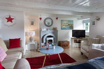 The lovely sitting room. As you would expect from a cottage of this age and character, there are low beams so tall guests be aware.