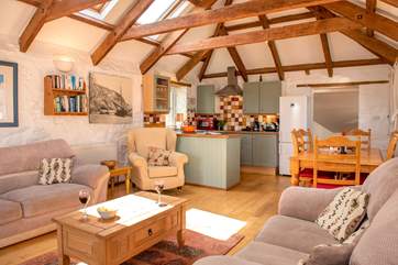 The barn conversion has lovely exposed beams.