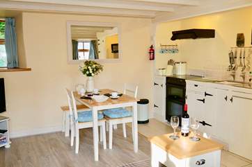 Hand-painted units in the small but well-equipped kitchen-area.