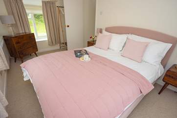 The main bedroom with hanging storage for your holiday belongings.