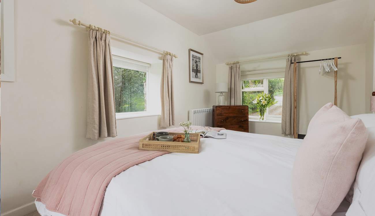 The main bedroom with hanging storage for your holiday belongings.