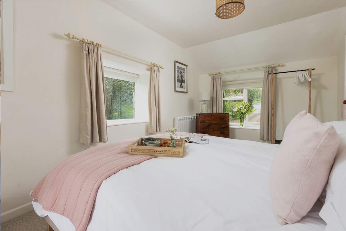 The main bedroom with hanging storage for your holiday belongings.