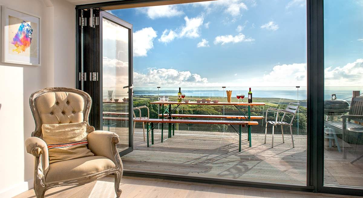 The large picture window, which leads out to the decking area, takes full advantage of the spectacular view.