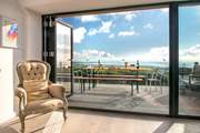 The large picture window, which leads out to the decking area, takes full advantage of the spectacular view.