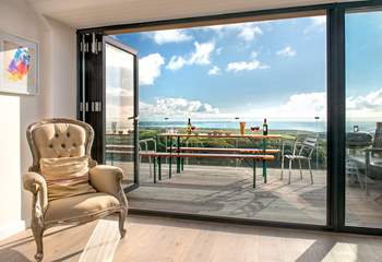 The large picture window, which leads out to the decking area, takes full advantage of the spectacular view.