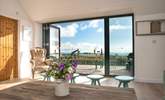 The bi-fold doors provide easy access to the balcony. - Thumbnail Image