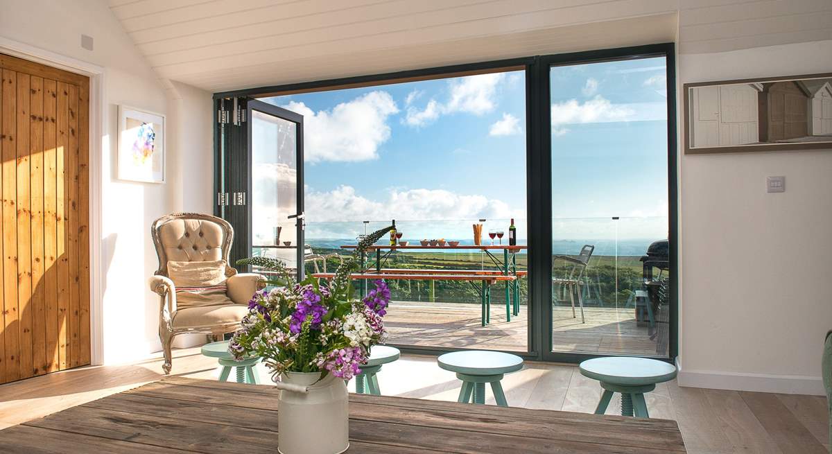 The bi-fold doors provide easy access to the balcony.