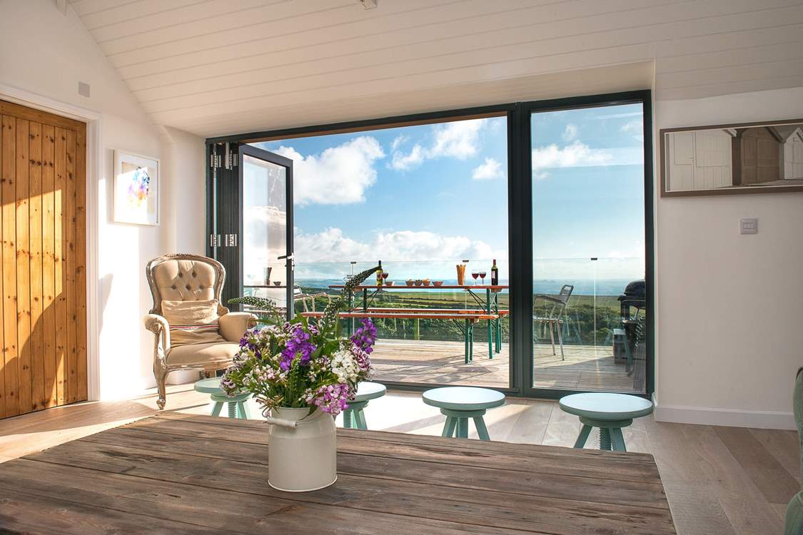 The bi-fold doors provide easy access to the balcony.