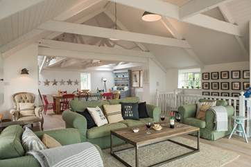 The stylish open plan living-room is very spacious.