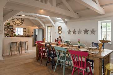 The dining-table sits next to the kitchen-area, which makes it really easy when serving up.