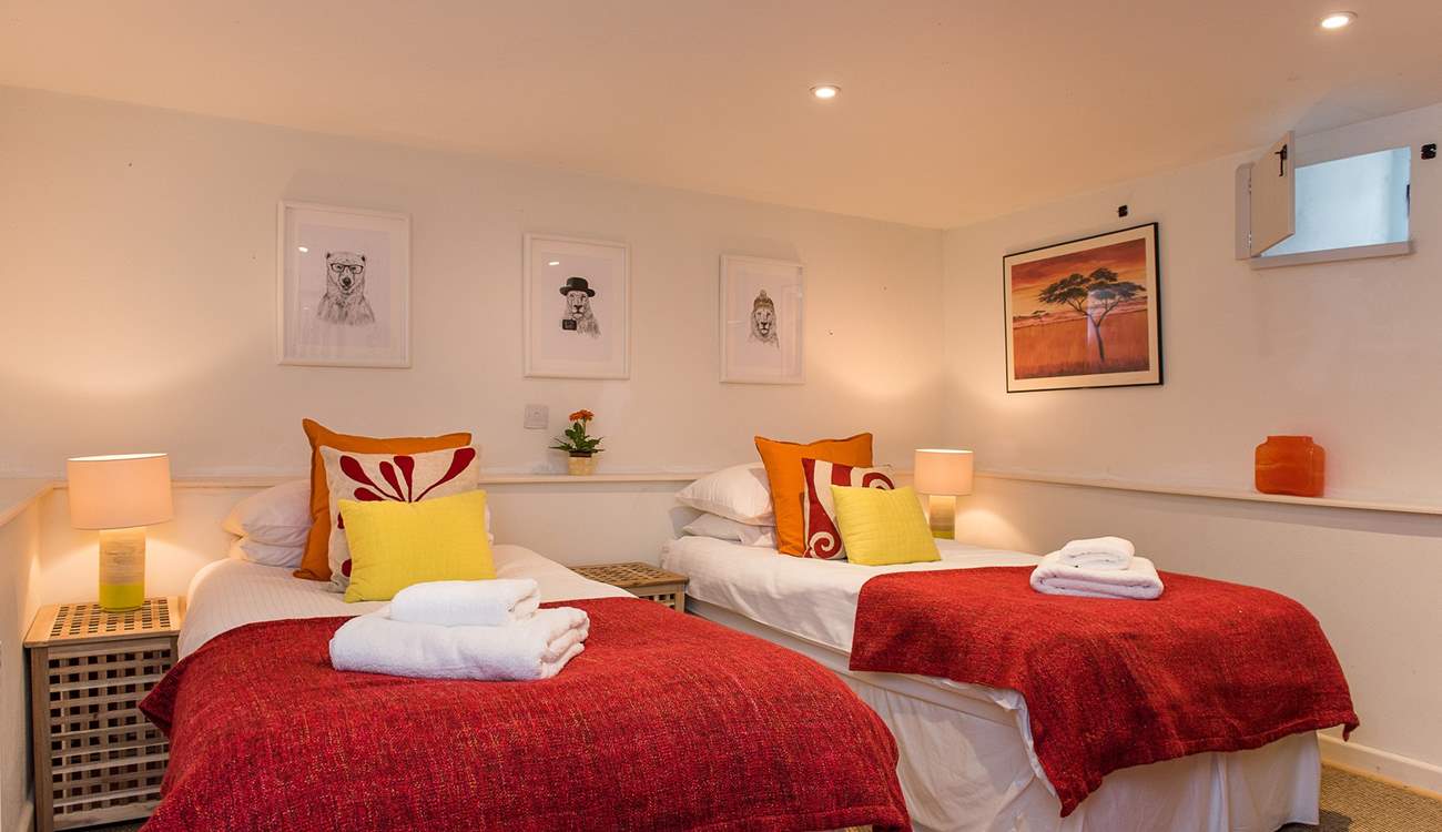 Bedroom 3 has lovely bright cushions and throws.