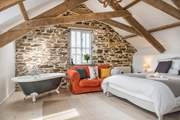 Bedroom 1 on the first floor - is beautifully furnished and even has a roll-top bath.
