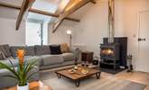 The toasty wood-burner makes this a perfect retreat whatever the weather. - Thumbnail Image