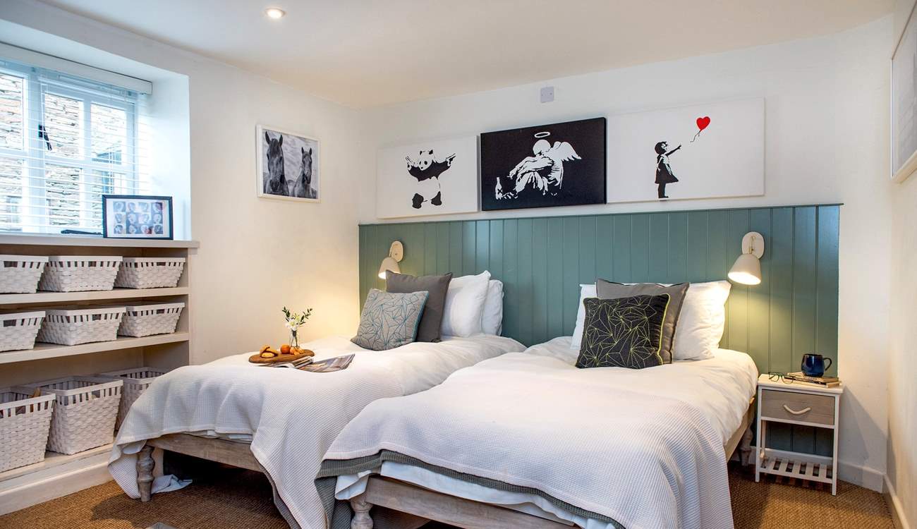 Twin beds await in the fourth bedroom.