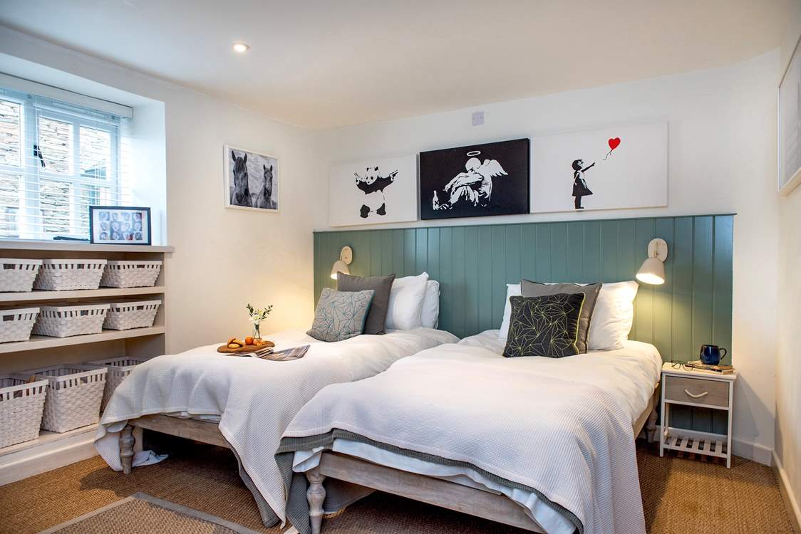 Twin beds await in the fourth bedroom.