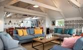 The stylish open plan living-room is wonderfully spacious and a great place for all to gather. - Thumbnail Image