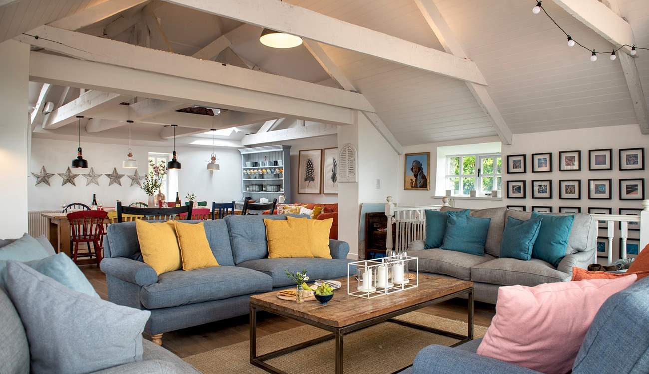 The stylish open plan living-room is wonderfully spacious and a great place for all to gather.