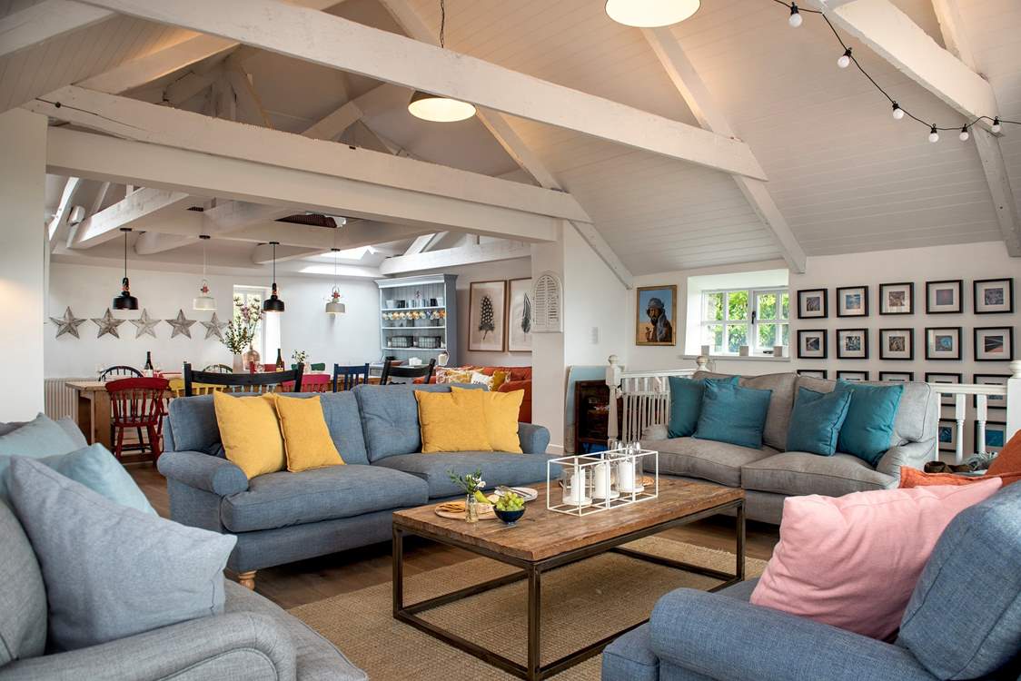 The stylish open plan living-room is wonderfully spacious and a great place for all to gather.