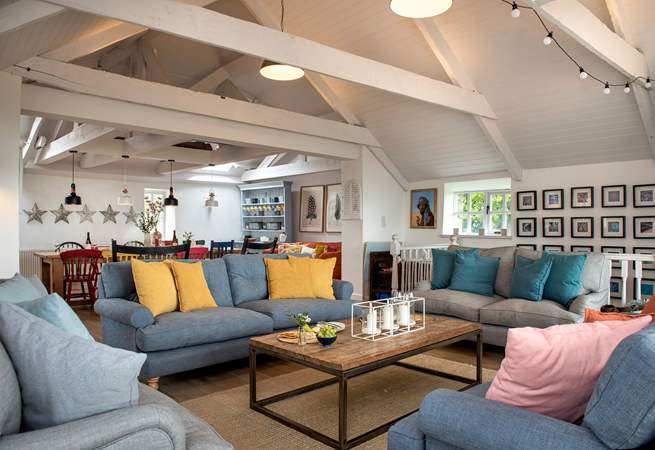 The stylish open plan living-room is wonderfully spacious and a great place for all to gather.