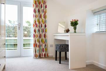 Patio doors lead from Bedroom 1 to the garden.
