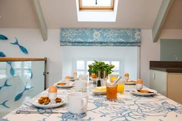 The large dining-table has ample seating for all.