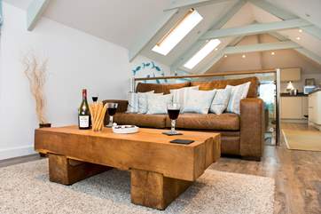 The open plan living-room is beautifully styled.