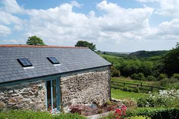 The barn is tucked into the hill.