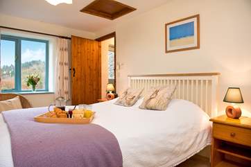 The comfy bedroom also enjoys views of the wonderful setting.