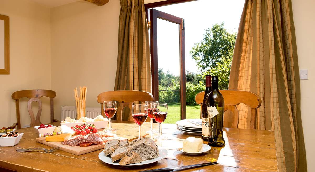 The patio doors lead out from the kitchen/dining-room to the garden.