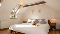 Bedroom 1 is light and airy and the bed is enormous!
