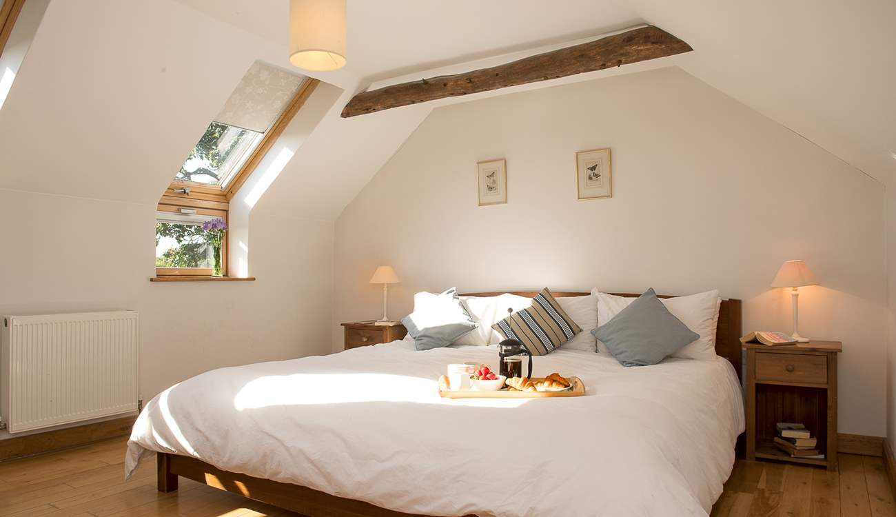 Bedroom 1 is light and airy and the bed is enormous!