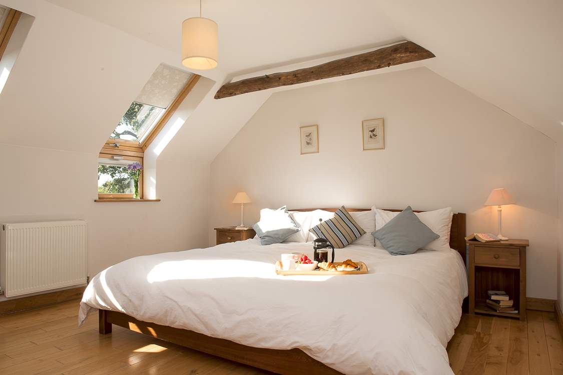 Bedroom 1 is light and airy and the bed is enormous!