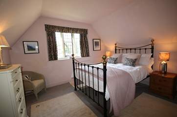 This is the double bedroom on the first floor. There is a feature Victorian fireplace.